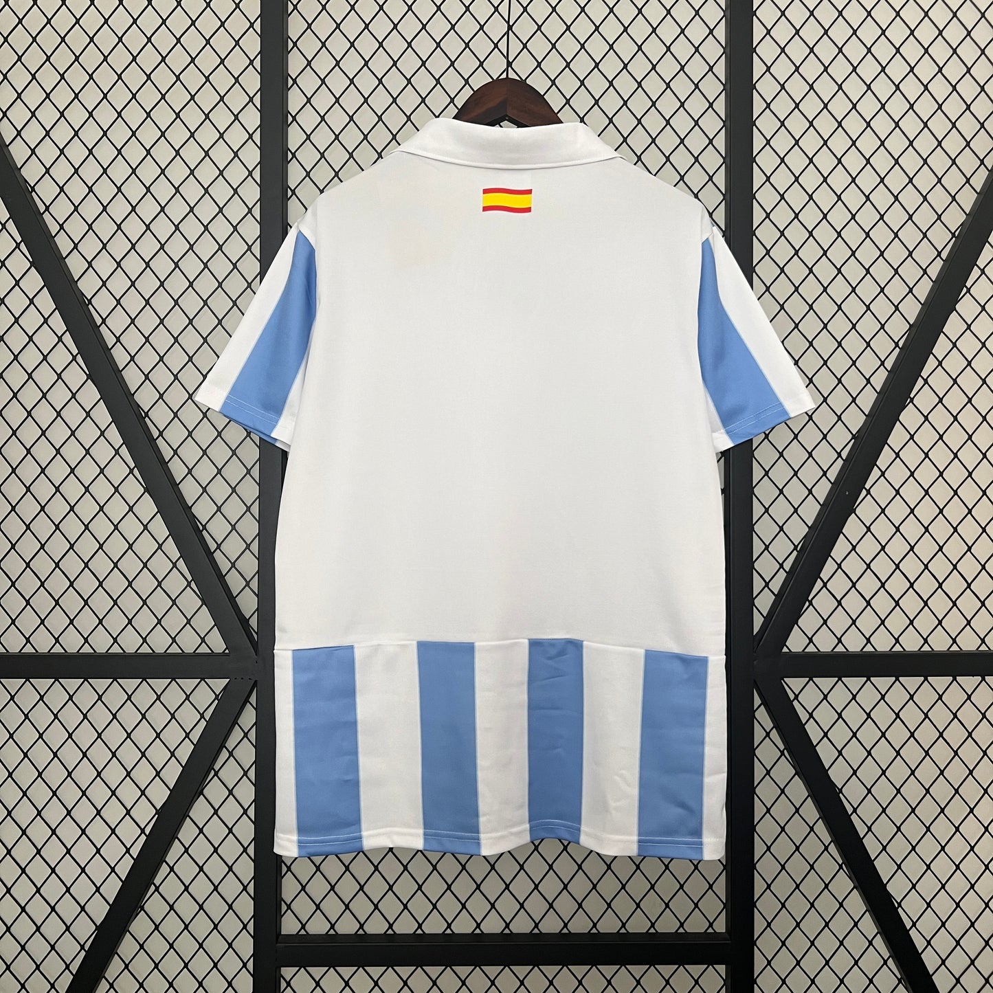 Málaga CF “UNESCO” 2012–13 — Camiseta home Nike celeste/blanca (cuello polo)