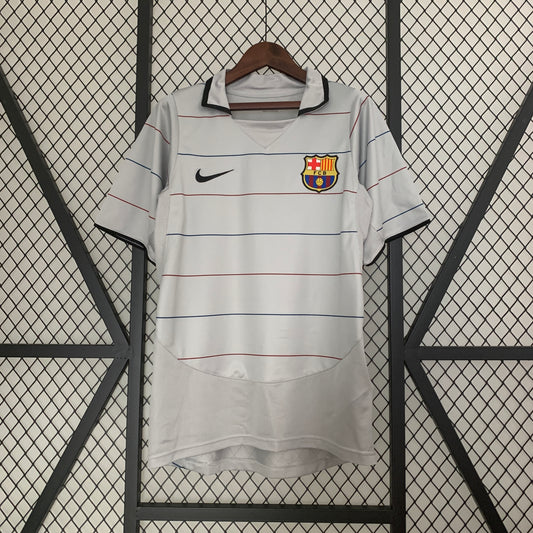FC Barcelona 2003–04 — Camiseta away Nike gris con líneas blaugranas