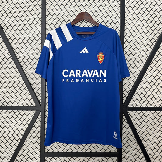 Real Zaragoza 2023–2024 (Away, Azul) – Caravan Fragancias