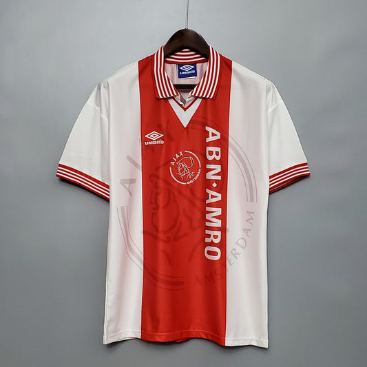 Ajax “ABN-AMRO” 1994–96 — Camiseta home Umbro blanca/roja (cuello polo rayado)