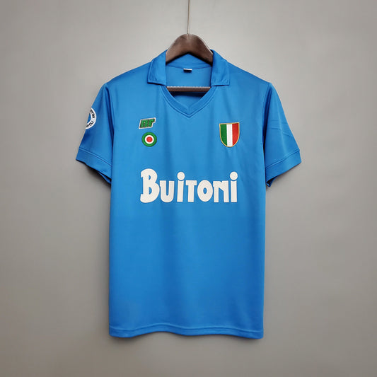 SSC Napoli “Buitoni” Scudetto 1987–88 — Camiseta home NR celeste (cuello en V)