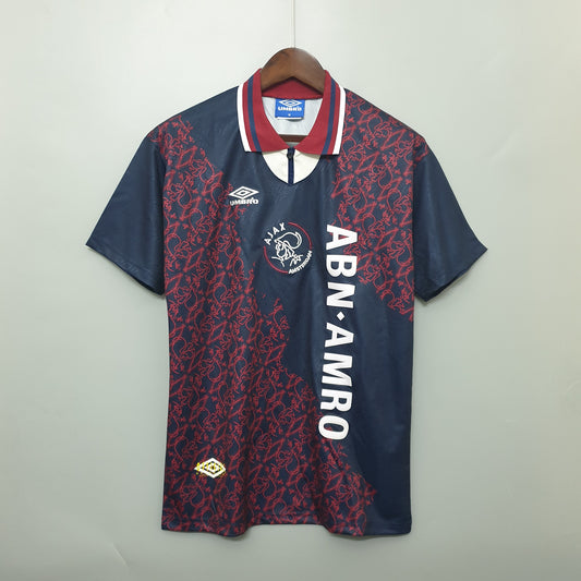 Ajax “ABN-AMRO” 1994–96 — Camiseta away Umbro azul marino (patrón rojo)