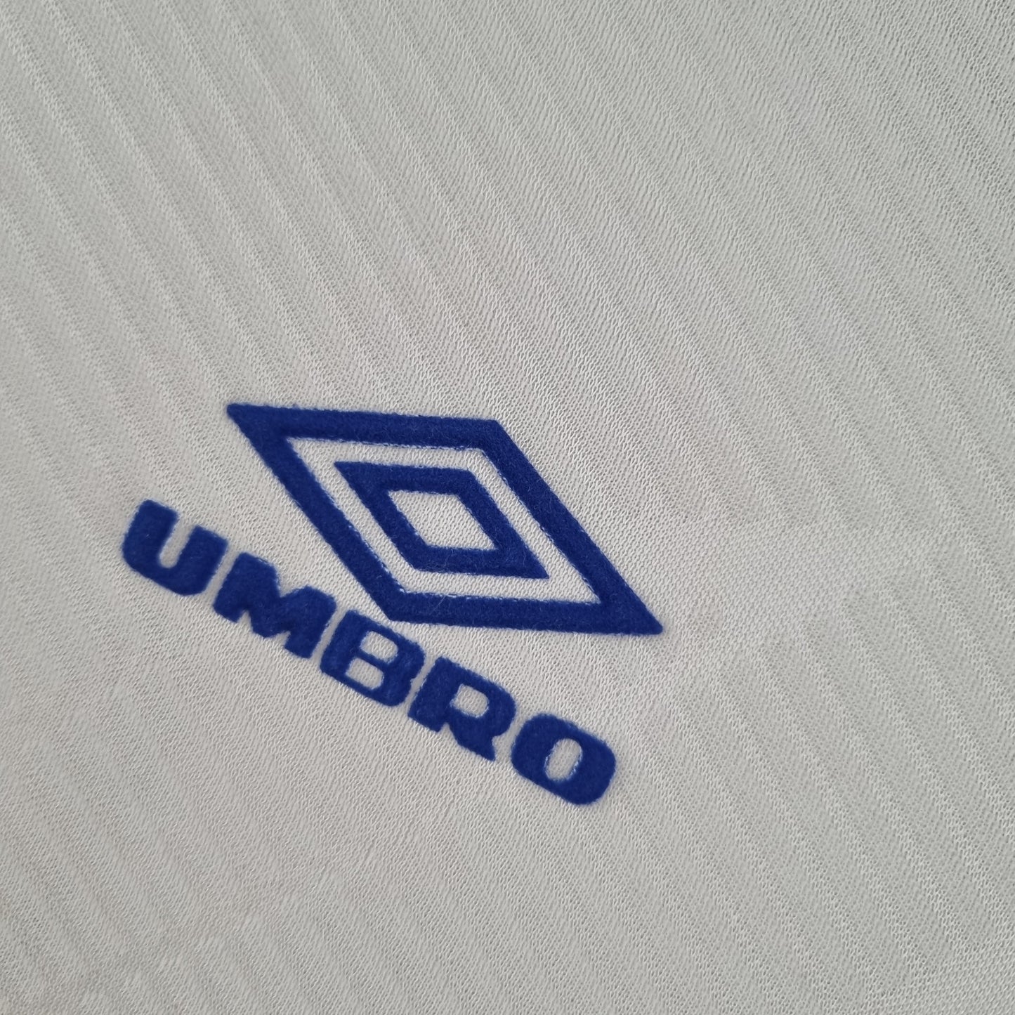 Parma A.C. “Parmalat” 1992–94 — Camiseta away Umbro blanca (cuello azul/amarillo)