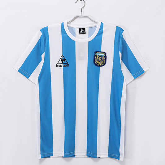 Camiseta Argentina Le Coq Sportif Local 1985–1987 (estilo Mundial 1986) – Rayas Celeste/Blanco